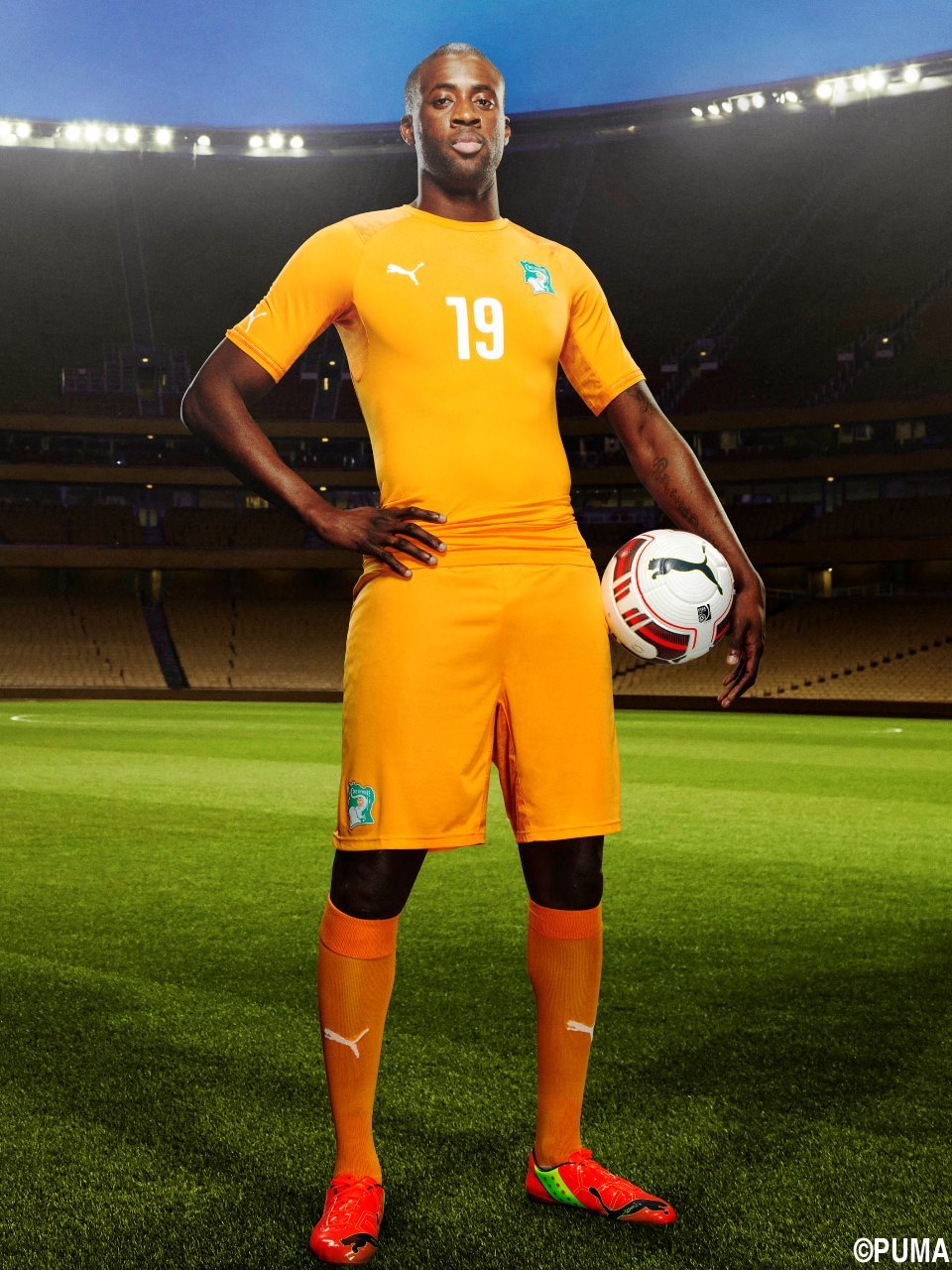 Yaya Touré in the 2014 Ivory Coast Home Kit that features PUMA's PWR ACTV Technology