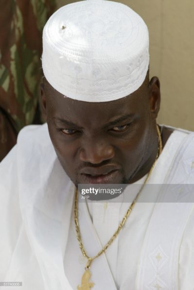 BOUAKE, IVORY COAST:  Wattao (L), one of the chief military commanders of the  New Force rebels, prays 14 November 2004 in Bouake, marking the end of the fasting month of Ramadan and the start of the Eid al-Fitr celebrations.        AFP PHOTO PHILIPPE DESMAZES  (Photo credit should read PHILIPPE DESMAZES/AFP via Getty Images)