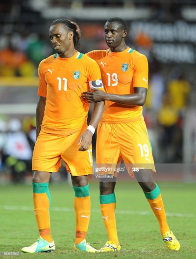 A dejected Didier Drogba of Ivory Coast is comforted by Yaya Toure after missing his penalty during the 2012 African Cup of Nations Final between Zambia and Ivory Coast at the Stade de l'Amitie in Libreville, Gabon. Photo: Ben Radford/Visionhaus (Photo by Ben Radford/Corbis via Getty Images)