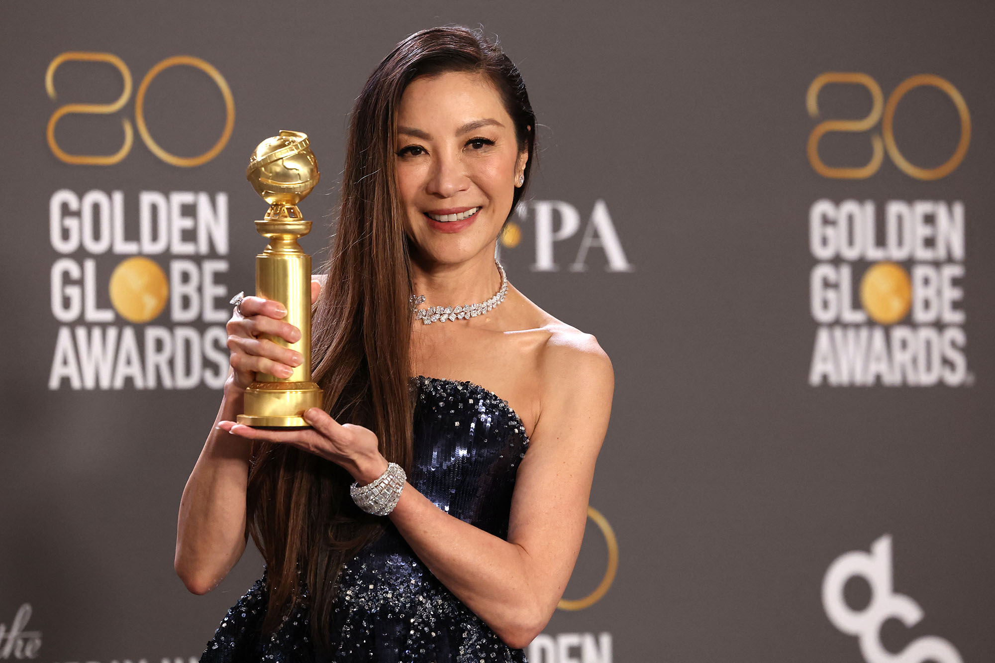 Michelle Yeoh poses with her award for Best Actress in a Musical or Comedy Motion Picture for "Everything Everywhere All at Once" at the 80th Annual Golden Globe Awards in Beverly Hills, California, U.S., January 10, 2023. REUTERS/Mario Anzuoni